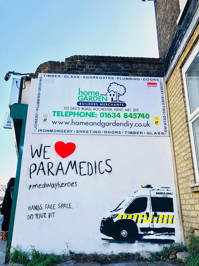 'We Heart Paramedics' shows half an ambulance coming out of the right wall. It reads 'We heart Paramedics' #medwayheroes Hands. Face. Space. Do your bit. 